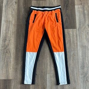 Balera Dancewear pants. Adult size medium.  Orange, white and black sweatpants.
